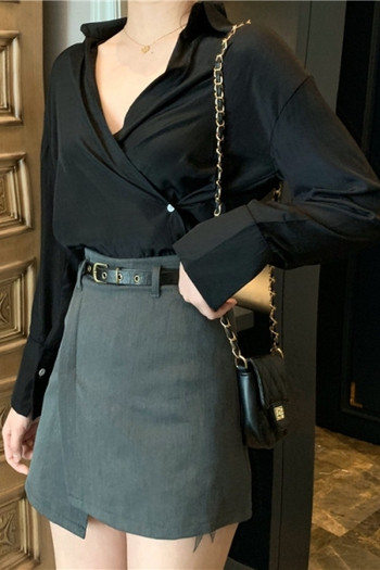 Asimetrična ženska suknja s visokim strukom i kožnim remenom