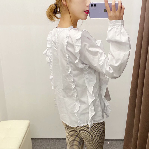 Naiste vabaaja lokkidega pluus valge