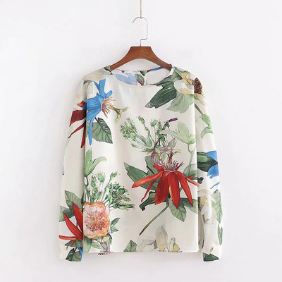 Bluză de damă elegantă, cu decolteu oval, mâneci lungi și motive florale