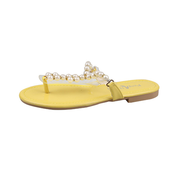 Női papucs az orr felett lapos talppal és gyöngyökkel