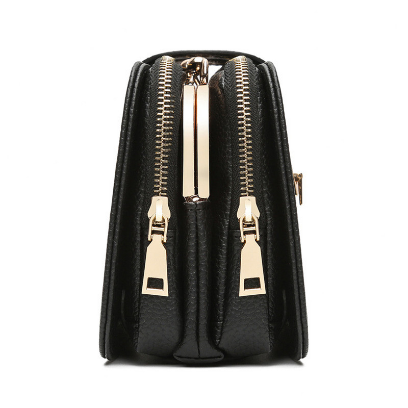 Kis fekete hölgy fekete színben pillangós hímzéssel és fém fogantyúval