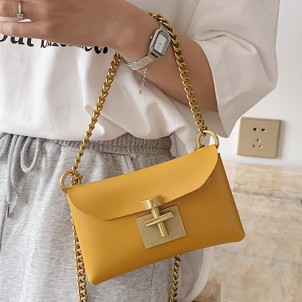 Öko-nahast ja metallist kinnitusega moodne naistekott