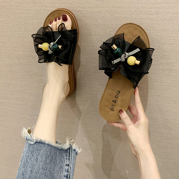 Модерни дамски чехли с равна подметка и панделка