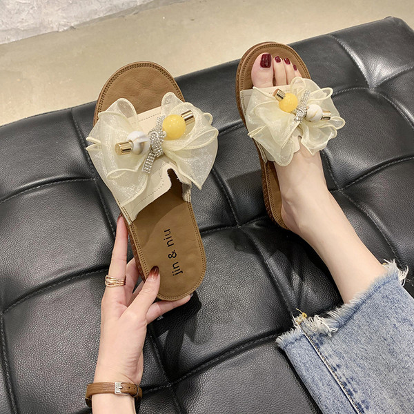 Модерни дамски чехли с равна подметка и панделка