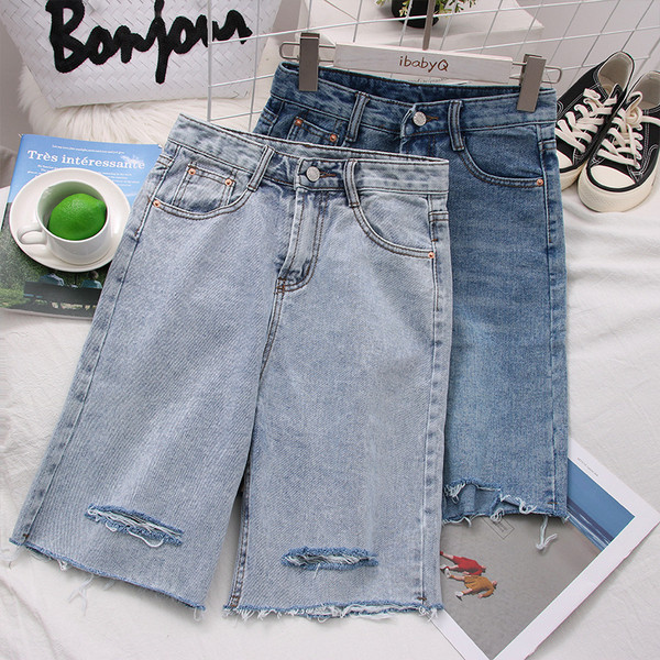 Női farmer 3/4-es nadrág magas derékkal, szakadt motívumokkal