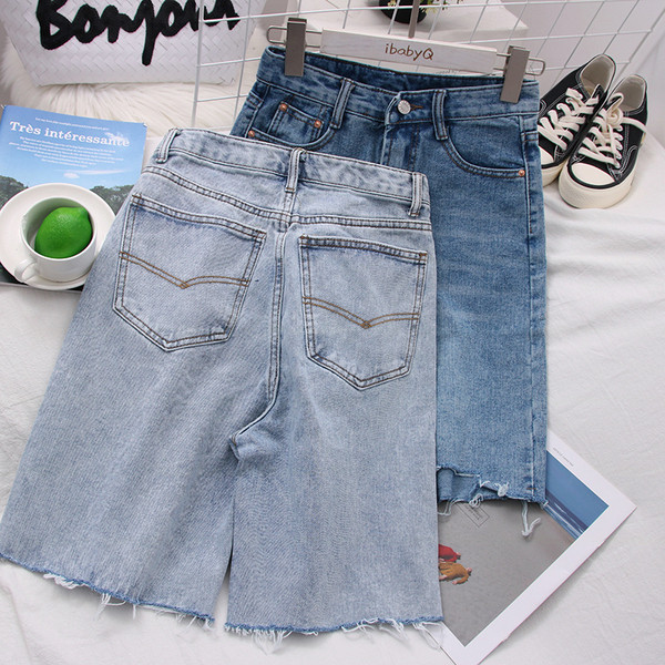 Női farmer 3/4-es nadrág magas derékkal, szakadt motívumokkal