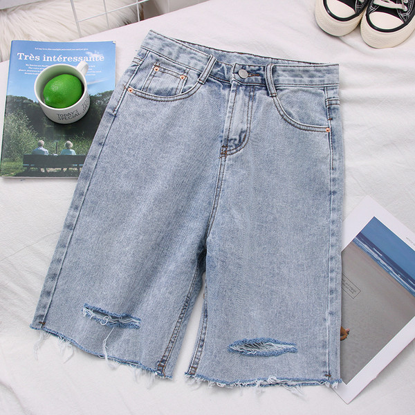 Női farmer 3/4-es nadrág magas derékkal, szakadt motívumokkal