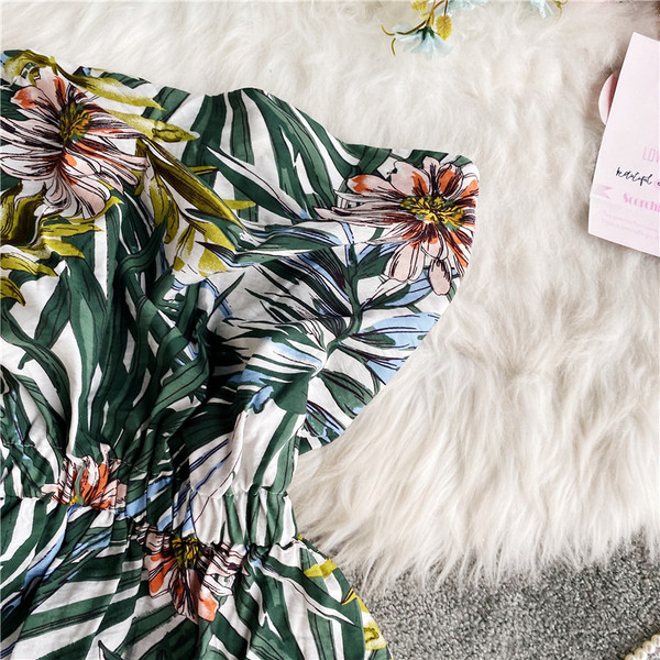 Alkalmi női overál rugalmas derékkal, virágmintával