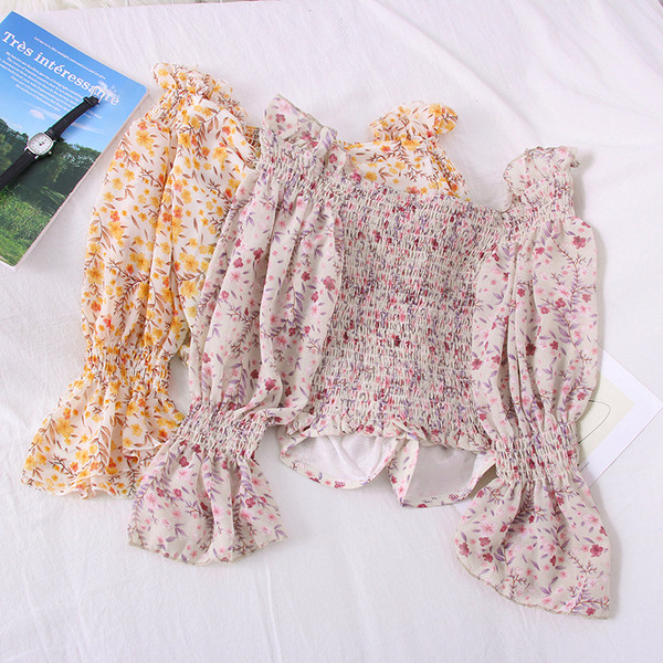 Modern női blúz csónakos nyakkivágással és lótusz ujjakkal