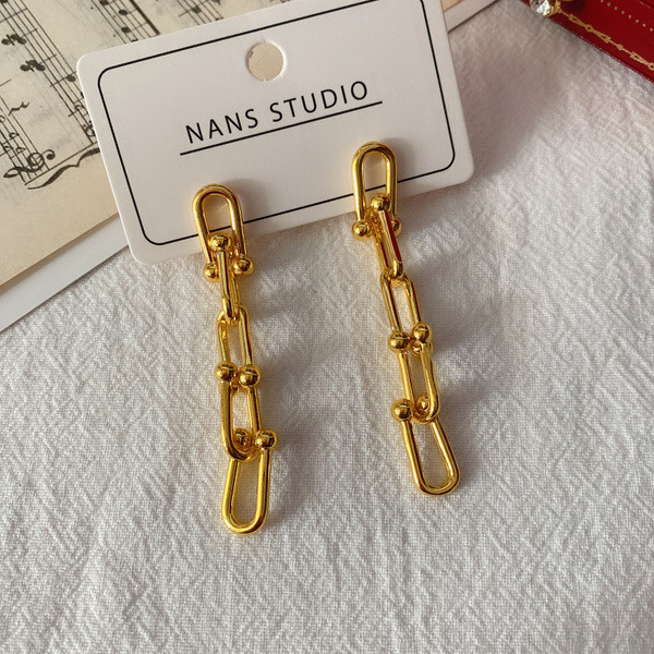 Moderne ženske viseće naušnice u zlatnoj boji