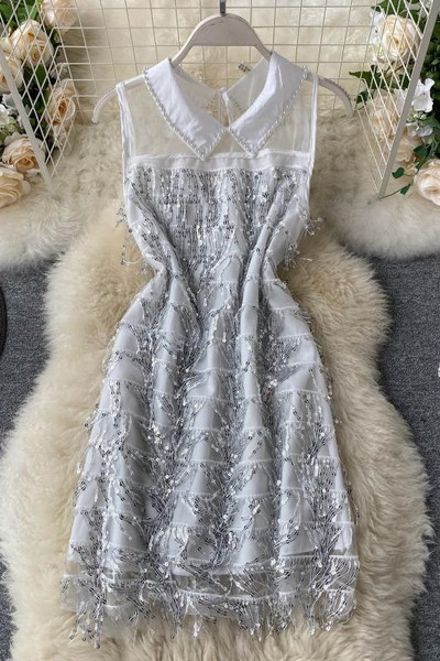 Moderna ženska haljina sa klasičnom kragnom i šljokicama