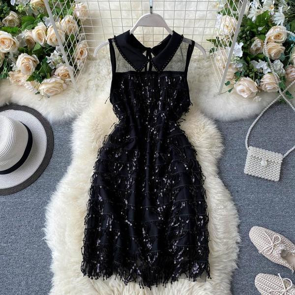 Moderna ženska haljina sa klasičnom kragnom i šljokicama