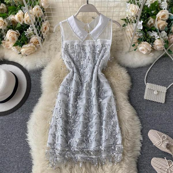 Moderna ženska haljina sa klasičnom kragnom i šljokicama