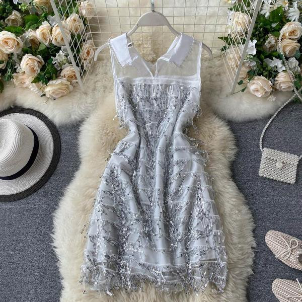 Moderna ženska haljina sa klasičnom kragnom i šljokicama