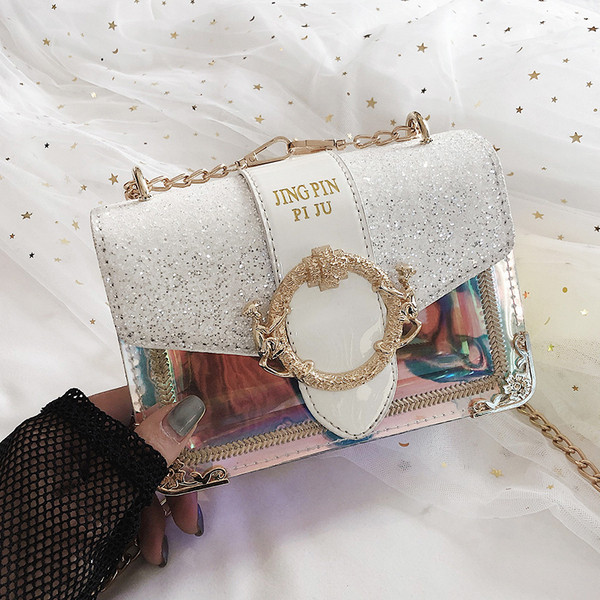 Stílusos női táska fém díszítéssel és fényes részecskékkel