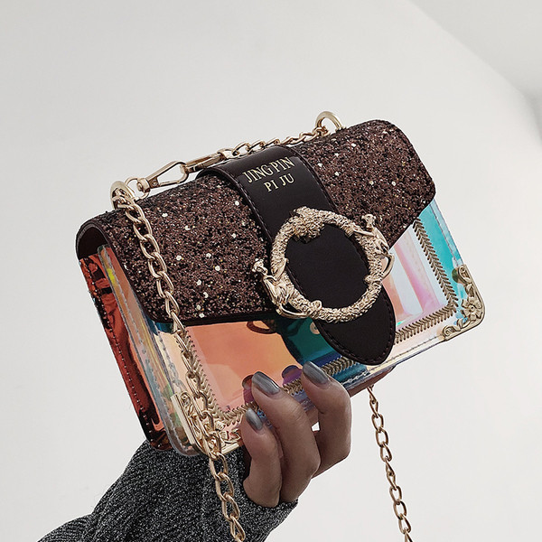 Stílusos női táska fém díszítéssel és fényes részecskékkel