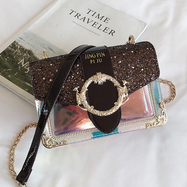 Stílusos női táska fém díszítéssel és fényes részecskékkel