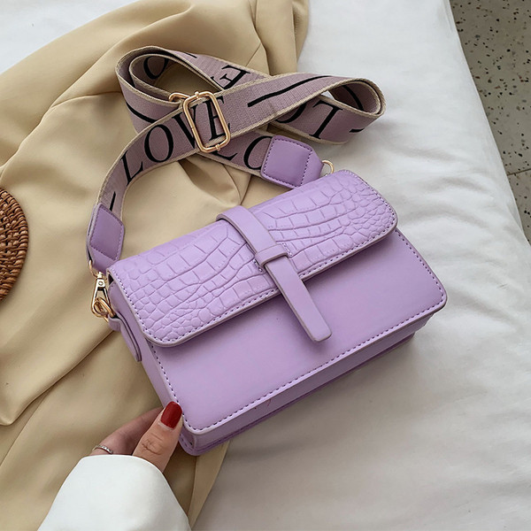 Modern női táska hosszú textil fogantyúval és fém csattal