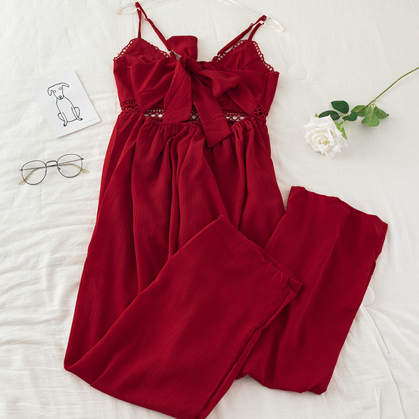 Μακριά γυναικεία ολόσωμη  φόρμα με ιμάντες και λαιμόκοψη