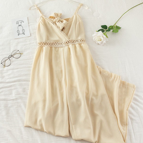 Μακριά γυναικεία ολόσωμη  φόρμα με ιμάντες και λαιμόκοψη