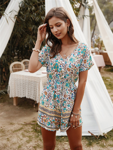 Női overall spitz nyakkivágással és virágmintával