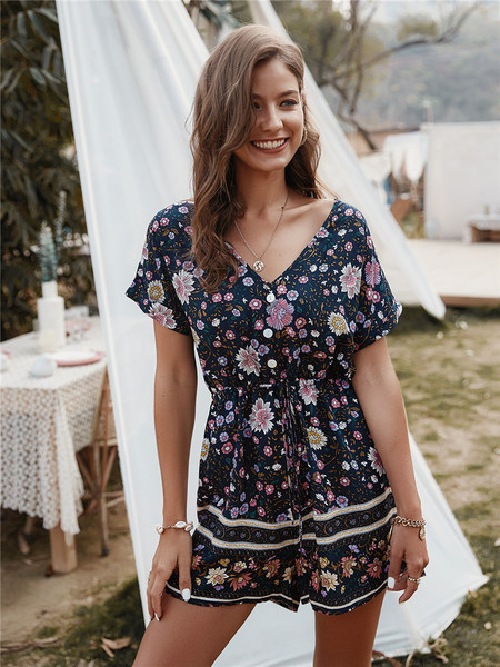 Női overall spitz nyakkivágással és virágmintával