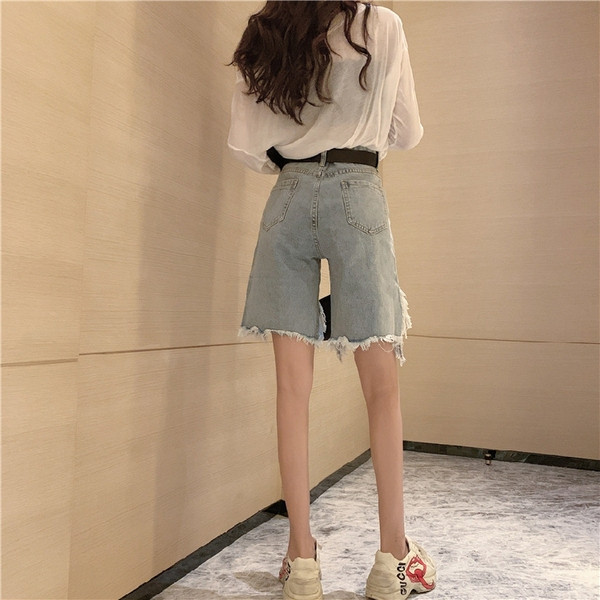 Naiste lühikeste teksapükste uus mudel rebenenud parema ja kõrge vöökohaga - asümmeetriline mudel