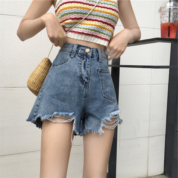 Kahes värvitoonis vabaaja naiste kõrge vöökoha ja rebenenud mustriga lühikesed teksad