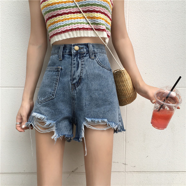 Kahes värvitoonis vabaaja naiste kõrge vöökoha ja rebenenud mustriga lühikesed teksad