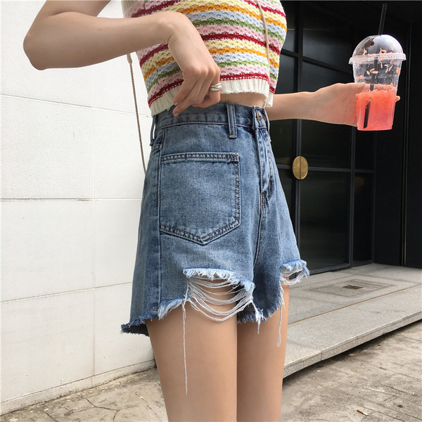 Kahes värvitoonis vabaaja naiste kõrge vöökoha ja rebenenud mustriga lühikesed teksad