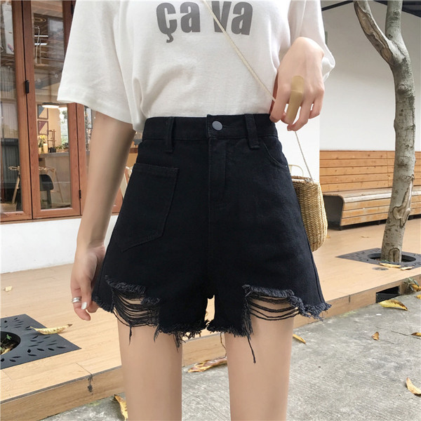 Kahes värvitoonis vabaaja naiste kõrge vöökoha ja rebenenud mustriga lühikesed teksad