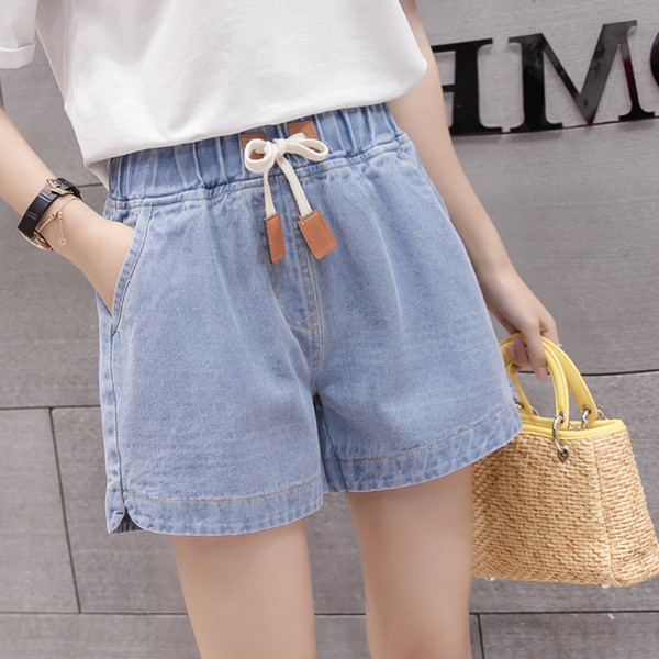 Naiste vabaaja lühikesed püksid elastse vöökoha ja taskutega