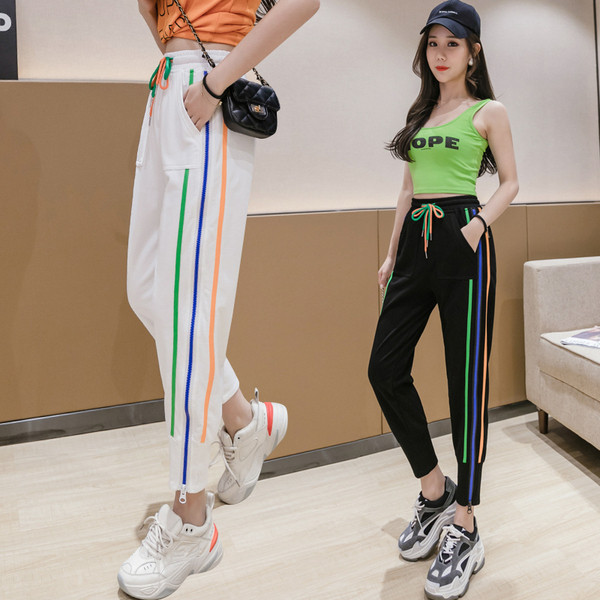 Vabaaja naiste spordipüksid luku ja ääristega