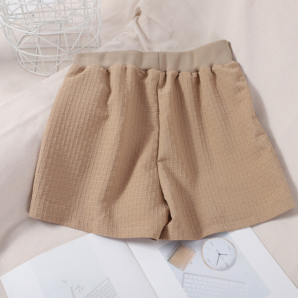 Naiste lühikesed püksid elastsete ja taskutega