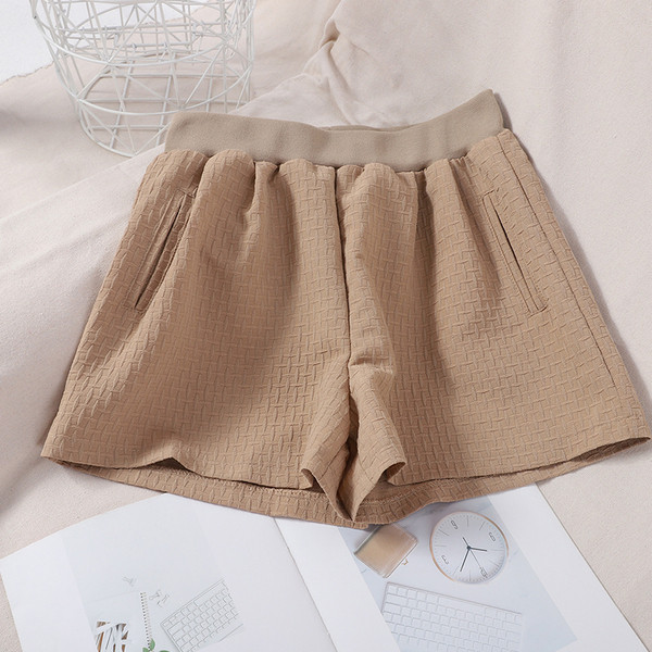 Naiste lühikesed püksid elastsete ja taskutega