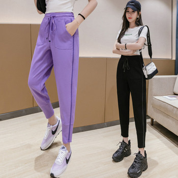 Модерни дамски спортни панталони с цип и връзки 