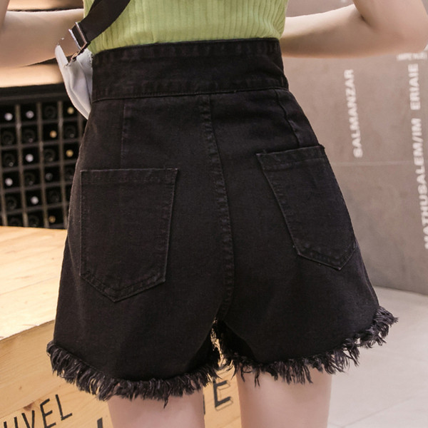 Női rövid farmer új modellje szakadt jobb oldali gombbal és magas derékkal