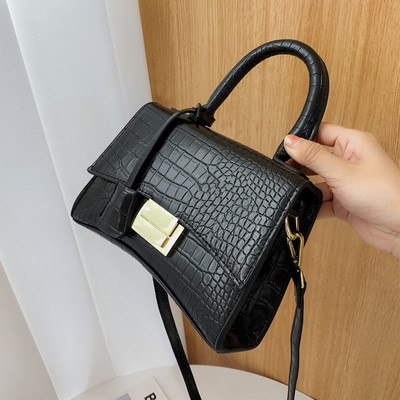 Moodne ökonahast pikkade ja lühikeste sangadega ning metallist kinnitusega naiste kott