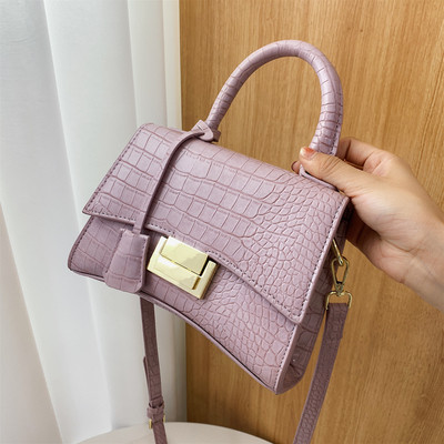 Moodne ökonahast pikkade ja lühikeste sangadega ning metallist kinnitusega naiste kott