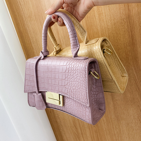 Moodne ökonahast pikkade ja lühikeste sangadega ning metallist kinnitusega naiste kott