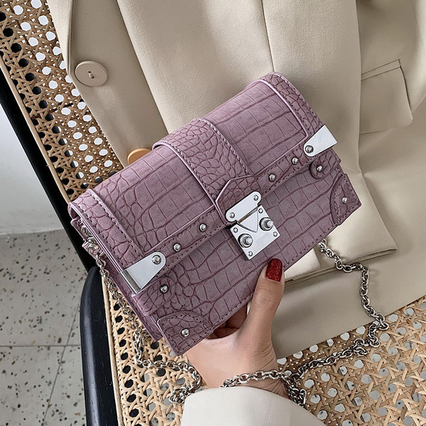 Naiste öko-nahast metallielementide ja pika sangaga kott