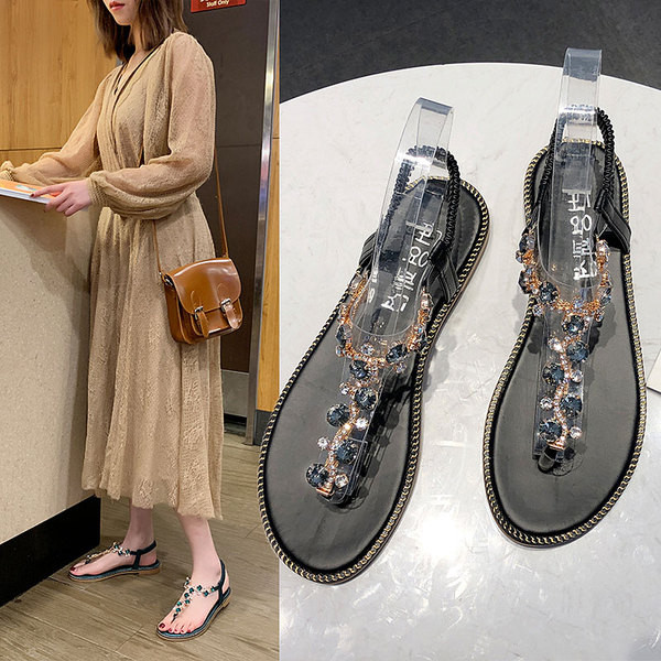 Moodsad kivikeste ja lameda tallaga naiste sandaalid