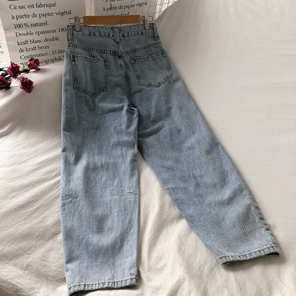 Kõrge vöökoha ja rebenenud motiividega vabaaja naiste teksapükste lai mudel