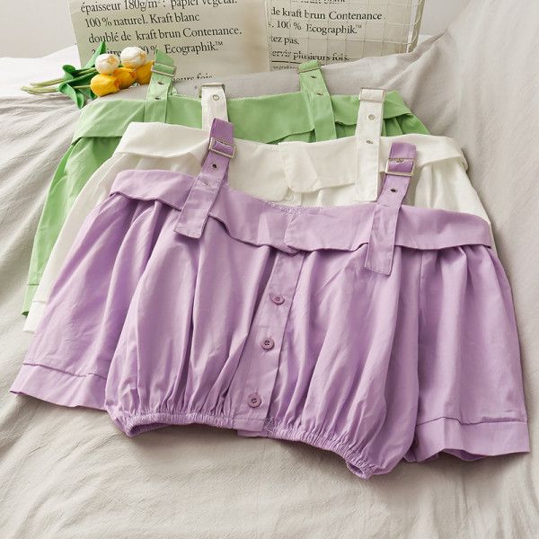 Modern női blúz csatokkal és gombokkal