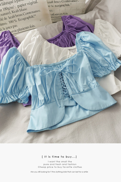 Női blúz leeső ujjakkal és nyakkendőkkel