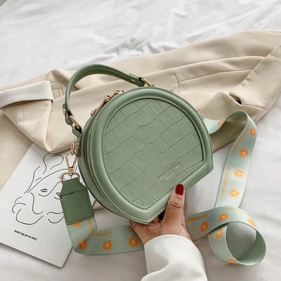 Korszerű női táska kerek formában, hosszú füllel