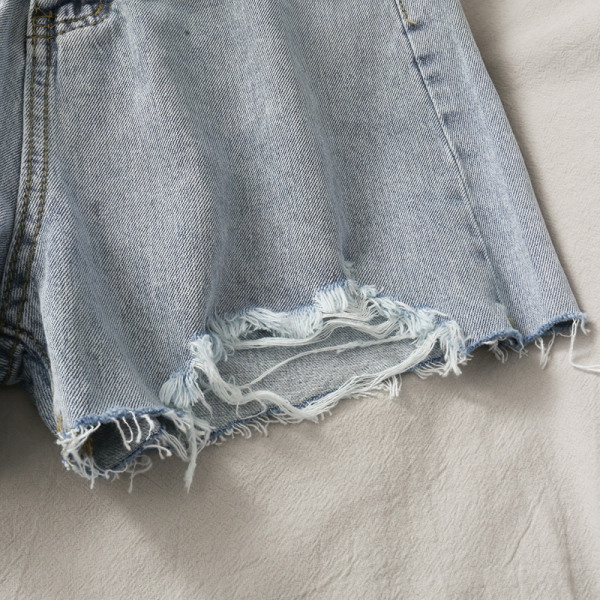 Rebenenud motiivide ja kõrge vöökohaga vabaaja naiste lühikesed teksad