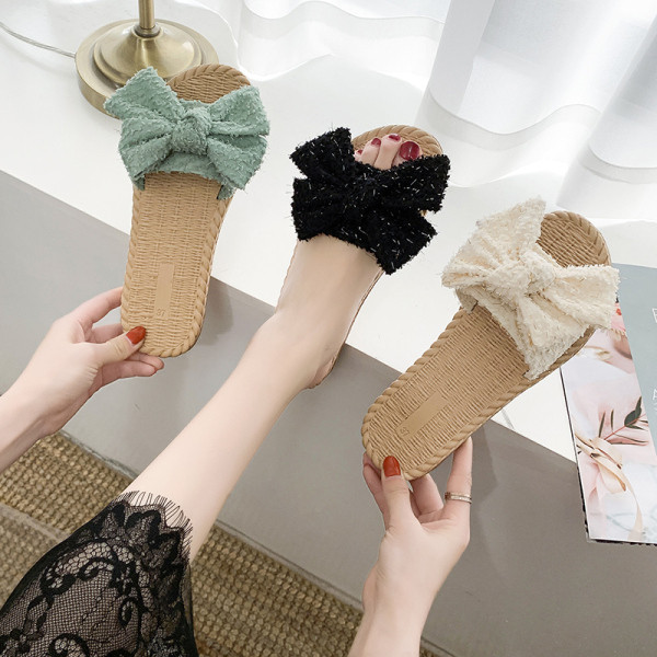 Papuci de damă cu talpă plată și element panglică