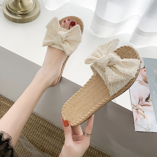 Papuci de damă cu talpă plată și element panglică