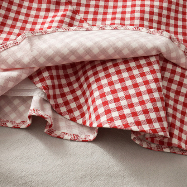 Lühike ruuduline lokkidega naiste seelik